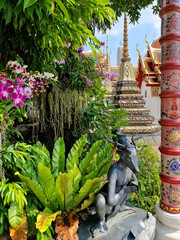 Amazing temple in Bangkok, Thailand, fountain with beautiful flowers