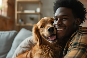 Young adult black man with his golden retriever dog in a living room