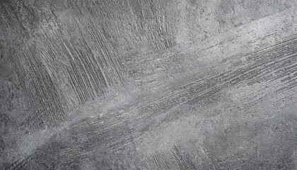 Close-up of a textured concrete surface in grayscale, showcasing intricate patterns and lines. Ideal for backgrounds or overlays.
