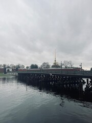 Fototapeta premium Gray sky riverside, city river, melancholic mood