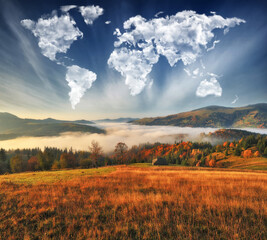 clouds in the form of a map of the world over the mountains. autumn dawn in the Carpathians. Travel and landscape concept  - obrazy, fototapety, plakaty