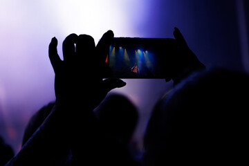 Audience Enjoying Music in a Dark Indoor Venue