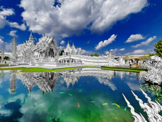 The famous white temple in Chiang Mai, northern Thailand, reflected in the lake with a gorgeous sky