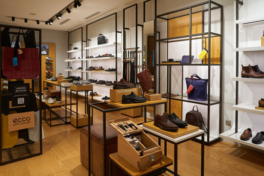 SINGAPORE - NOVEMBER 06, 2023: various footwear displayed at ECCO store in Singapore. ECCO is a Danish shoe and leather accessories manufacturer.