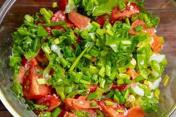 Vegetable salad avocado cherry tomato salted salmon boiled egg green onion close-up