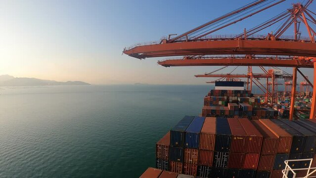 Shekou, China - 09.16.2023 Timelapse of container ship has loading operations with few gantry cranes in Shekou Container Terminal during.