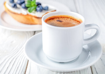 French toast with cheese and blueberries and a cup of coffee. Healthy breakfast