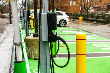 electric vehicle charging stations in public parking lot shot in beaches nieghbourhood toronto