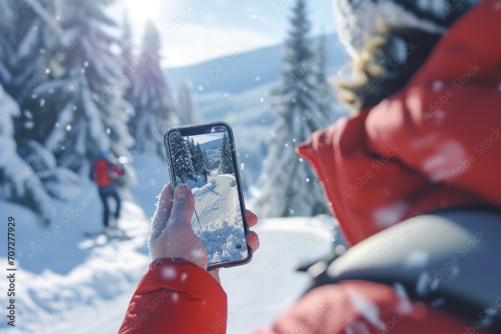 Poster a person capturing a moment in the snow. perfect for winter-themed projects