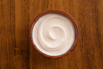 Brazilian cream cheese on wooden bowl. Studio shoot isolated on white background.