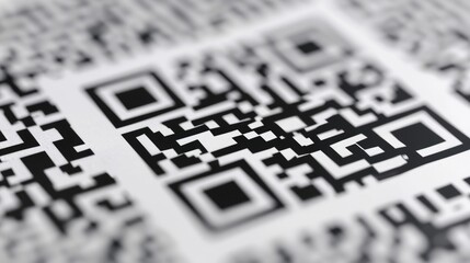 A close up view of a QR code on a piece of paper. Can be used for digital marketing, mobile payments, and scanning applications - Powered by Adobe