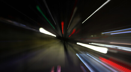 Abstract background. Frizzlight of the night city. Soft bokeh of moving objects.