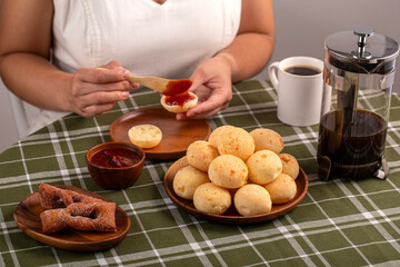 Typical Brazilian Breakfast. Humanized shoot. Pão de Queijo. Guava cream.
