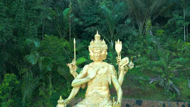 Aerial view on Gold Brahma God Statue on Jungle Desa Duda in Bali. Discover the Rich Hinduism Heritage of Asia's Vacation Destination in Indonesia.