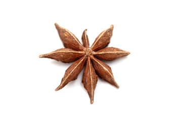 Anise seed stars on a white background.