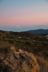 A rock overlooking a dramatic red sunset, Spain, Andalusia
