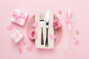 Festive table setting for Valentine's Day on color background, top view