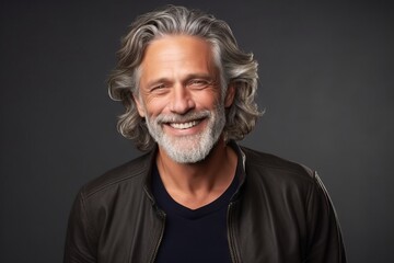 Portrait of a happy senior man with gray hair and beard. - obrazy, fototapety, plakaty