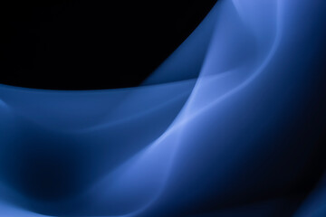 Blue abstract foggy background of waves and smooth lines on black. Design element. Copy Space.