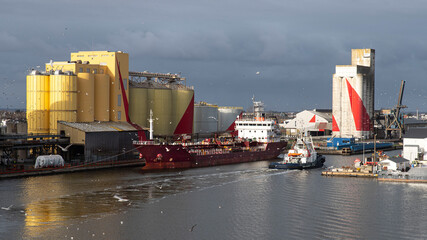 Boat and grain silo in the port of Saint-Nazaire in Brittany, France