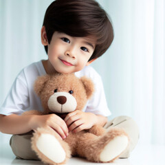 A cute boy playing with a teddy bear with copy space for text on solid white background. ai generative