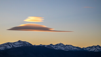 Sunset over the mountains in southern Chile with lenticular clouds