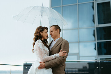 bride and groom first meeting on the roof of skyscraper