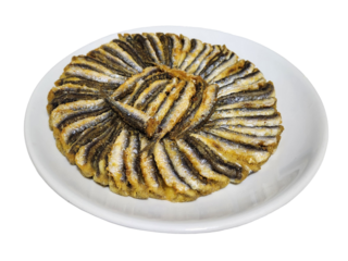 Fries anchovies in a pan isolated in white plate