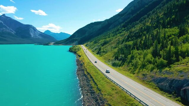 Drone footage of a road beside Abraham lake, alberta, canada. 