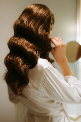 Fototapeta premium brown-haired girl in the morning in the bathroom