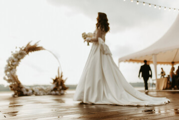 bride against the background of a yellow sunset
