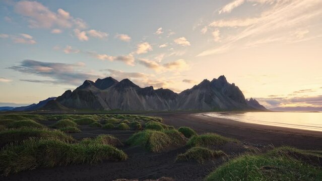 Sunrise over Vestrahorn mountain on black sand beach at Iceland