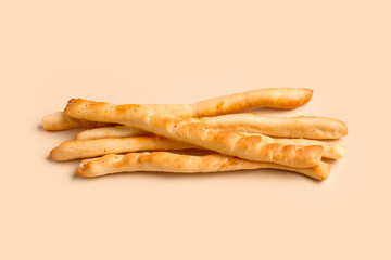 Tasty Italian Grissini on yellow background