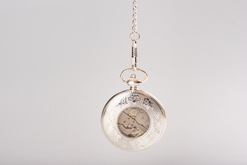 Antique watch, beautiful antique pocket watch with white background, selective focus.