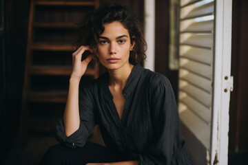 Portrait of a beautiful young brunette woman in a black shirt