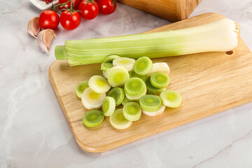 Ripe sliced leek over board