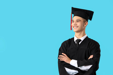 Male graduate student on blue background