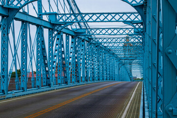 Perspective view of the John A. Roebling Suspension Bridge's blue steel framework.