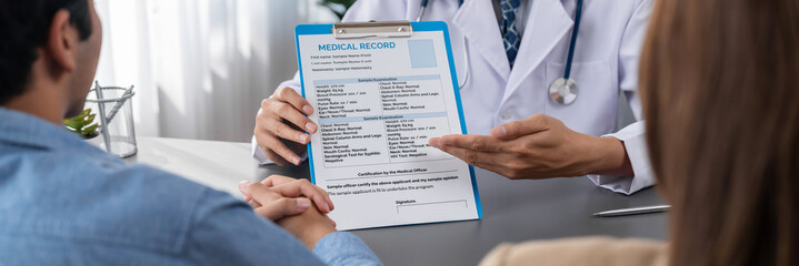 Doctor show medical diagnosis report and providing compassionate healthcare consultation to young...