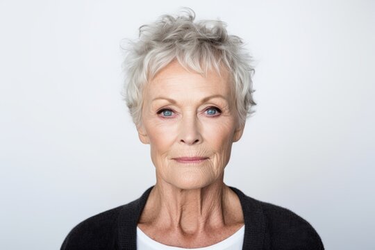 Portrait of a senior woman with grey hair looking at the camera