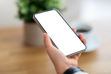 Woman hand holding phone with white blank screen