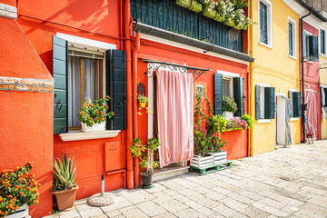Brightly colors tradition Venetian homes on the island of Murano in Venice Italy.