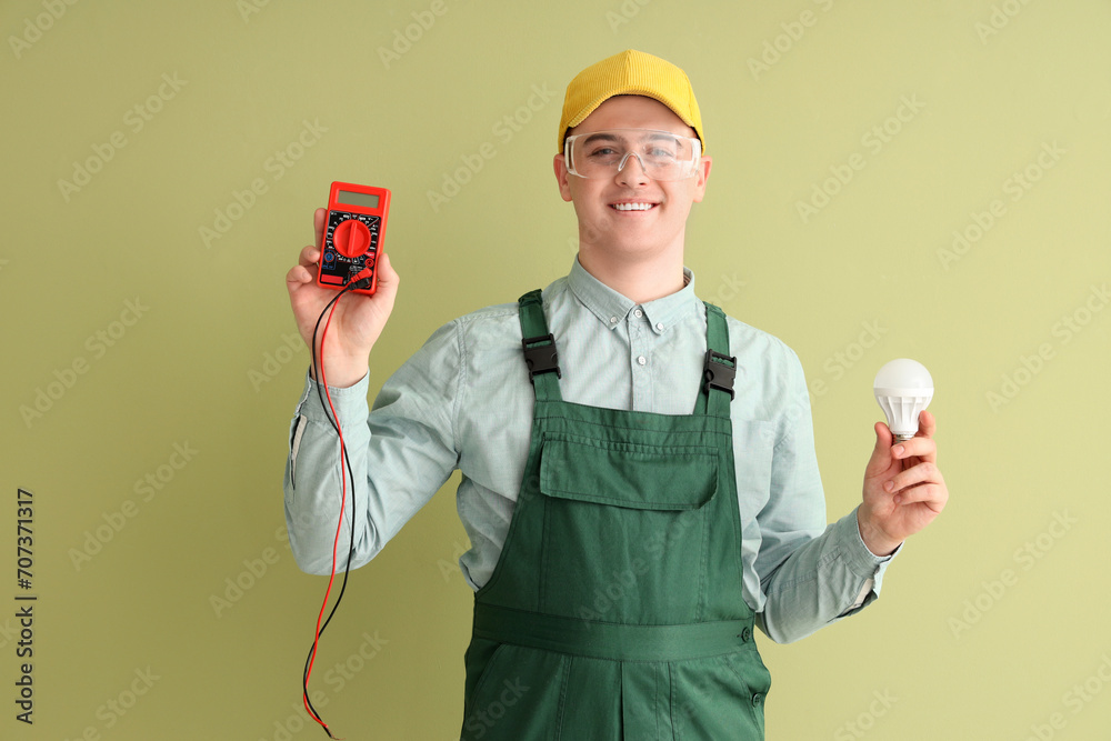 Sticker Male electrician with multimeter and light bulb on green background