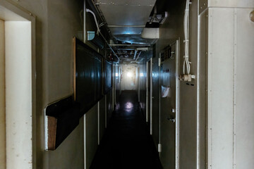Dark corridor at old abandoned ship
