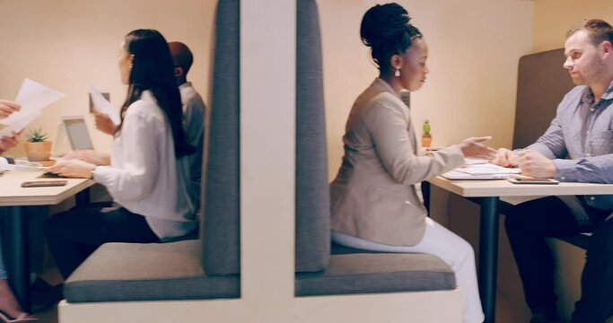 Business people, planning and team discussion at cafeteria in office startup with paperwork. Group, documents and creative designers in meeting for collaboration, coworking or brainstorming strategy