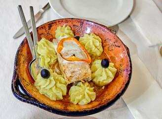 Gourmet Fish Dish with Mashed Potatoes and Olives. Concept of Gourmet Meal