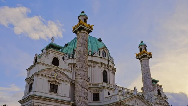 Exterior view of the St. Charles's Church, Karlskirche, featuring a baroque style at sunset, Vienna, Austria