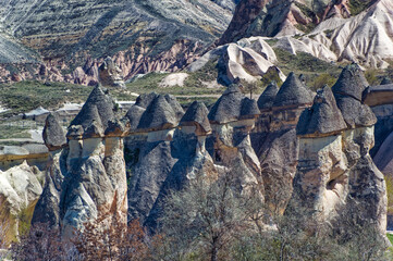 Cappadocia landscape soft volcanic rock, shaped by erosion into towers.