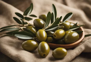 Foto op Plexiglas Olive branch with olive fruits on linen background Mockup for concept of wellbeing skincare beauty routine © FrameFinesse