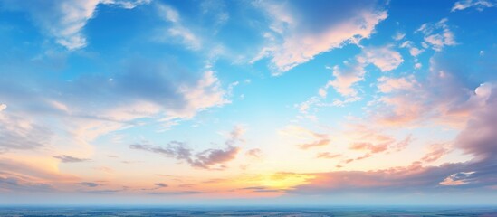 Naklejka na ściany i meble Scenic panorama evening sky with blue, white and orange clouds